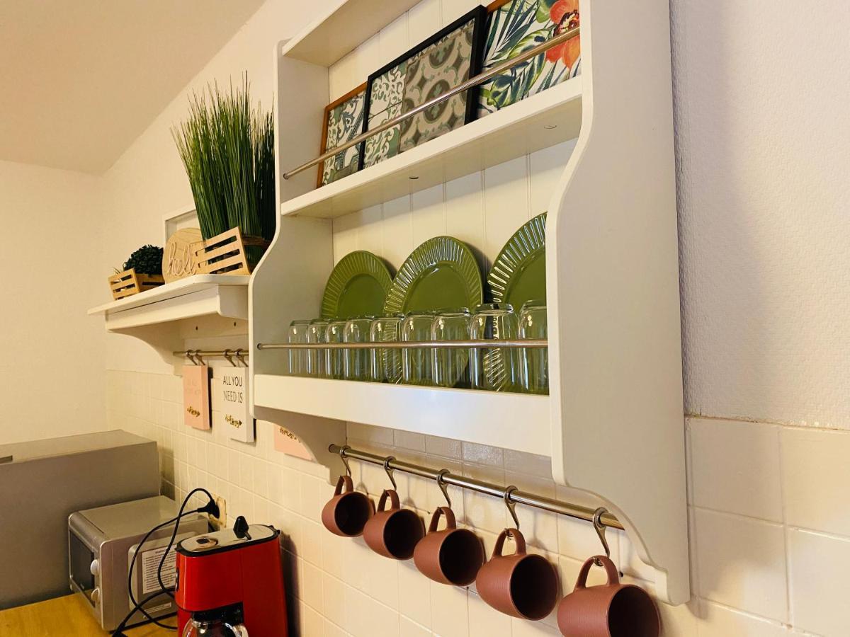 Tm Aparts Dortmund Esterno foto A wall-mounted plate rack